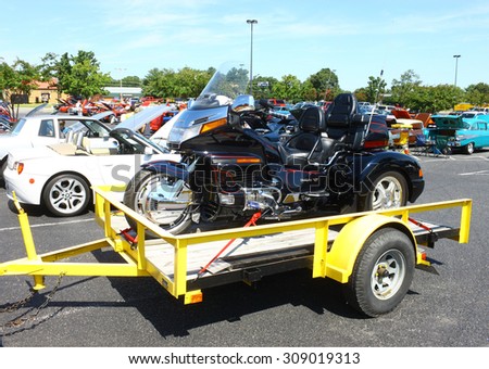 GLOUCESTER, VIRGINIA - AUGUST 22, 2015:A Honda Gold Wing on a trailer in the \
DRIVE-IN FOR DIABETES CAR SHOW Sponsored by Tractor Supply in August in \
Gloucester Virginia.
