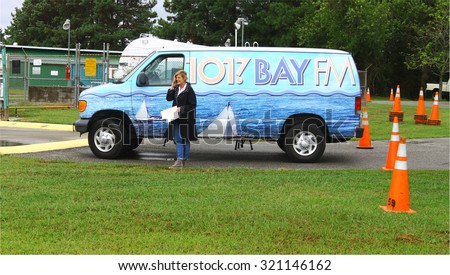MIDDLESEX, VIRGINIA - SEPTEMBER 26, 2015: BAY FM 101.7 radio station at the Wings Wheels & Keels 19th annual event, WKWI an Adult Contemporary formatted radio station licensed to Kilmarnock, Virginia.