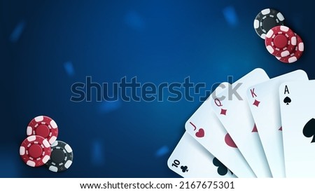 Casino playing cards and poker chips on blue background, top view