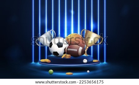 Champion cups and sport balls on blue podium floating in the air in dark scene with wall of line vertical blue neon lamps on background.