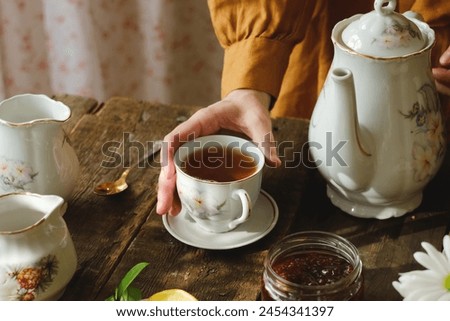 Similar – Image, Stock Photo Woman drinking a cup of coffee and using mobile