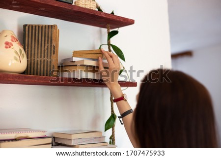 Similar – Image, Stock Photo Reach into the bookshelf