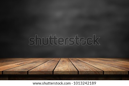 Wooden table with dark blurred background. Stok fotoğraf © 