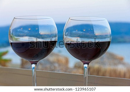 two glasses of red wine in a romantic atmosphere