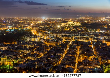 Athens skyline aerial view in the afternoon with the lights over blue hour, Syntagma, Greek Parliament and Parthenon are visible