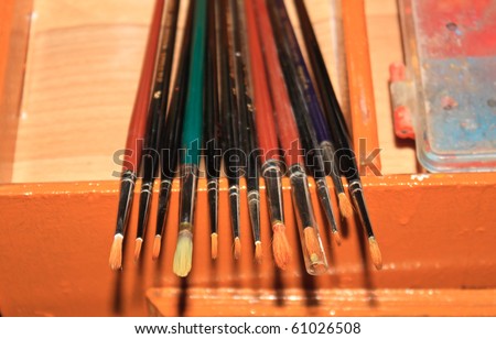 Various brushes for painting on wood and canvas