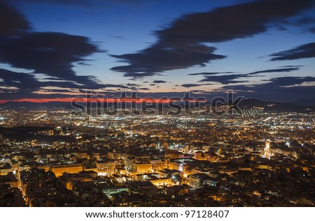 Athens skyline aerial view in the afternoon with the lights over blue hour