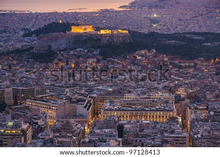 Athens skyline aerial view in the afternoon with the lights over blue hour, the Parthenon is visible