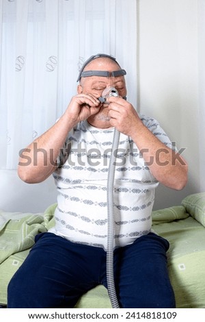 Similar – Image, Stock Photo Senior man inhaling airways and lungs applying medicine. Covid-19 or coronavirus treatment. Man breathing through face mask using nebuliser