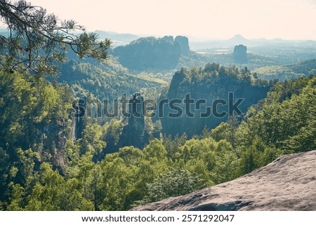 Similar – Elbsandsteingebirge, view from the Bastei bridge to the Ganssteine