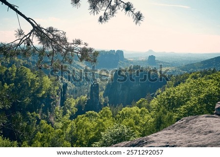 Similar – Elbsandsteingebirge, view from the Bastei bridge to the Ganssteine