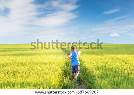 Similar – Image, Stock Photo Cheerful boy running through park