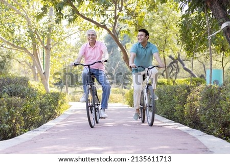 Similar – Image, Stock Photo Cycling in the park