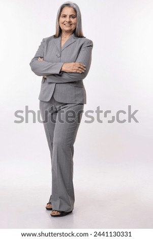 Similar – Image, Stock Photo Senior businesswoman standing in office