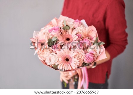 Similar – Image, Stock Photo Bouquet: gerbera and roses in yellow and pink in light blue watering can stands on stone floor