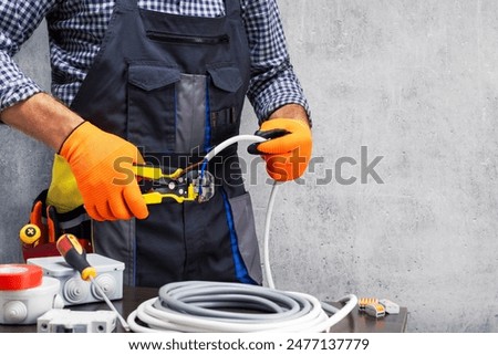 Similar – Image, Stock Photo Electrician working on the distribution panel of a house