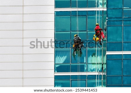 Similar – Image, Stock Photo Uniform facade of an office building with rows of vertical windows