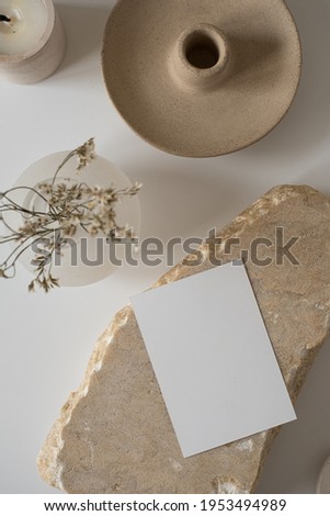 Blank paper sheet card with mockup copy space, dry flowers, marble stone. Minimal aesthetic business brand, blog, social media template background. Flat lay, top view Foto stock © 