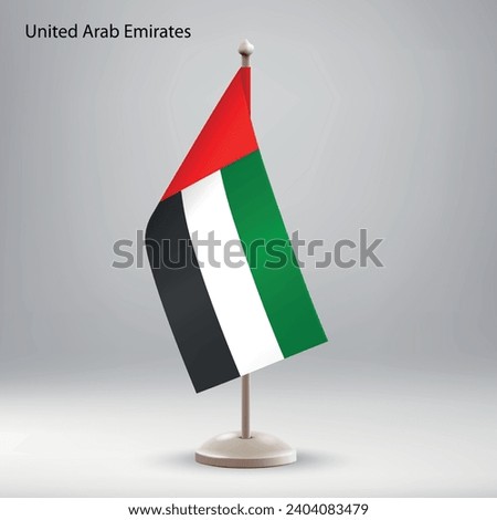 Flag of United Arab Emirates hanging on a flag stand. Usable for summit or conference presentaiton