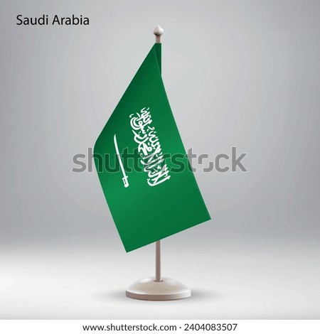 Flag of Saudi Arabia hanging on a flag stand. Usable for summit or conference presentaiton