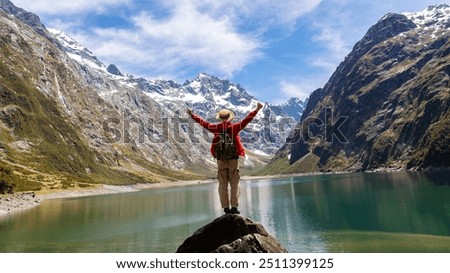 Similar – Image, Stock Photo Famous lake side view of Hallstatt village with Alps behind, Foliage leaves framed. Austria