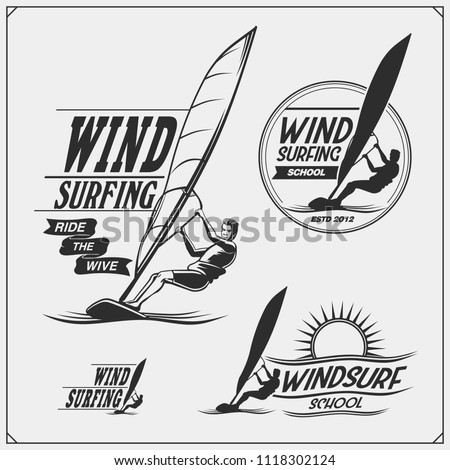 Set of windsurfing emblems, labels and badges. Surf design elements.