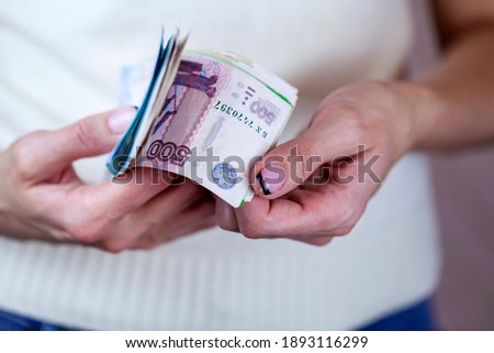 Exchange rates, Very happy girl with rubles in hand, inflation in Russia, pension, apartment payment