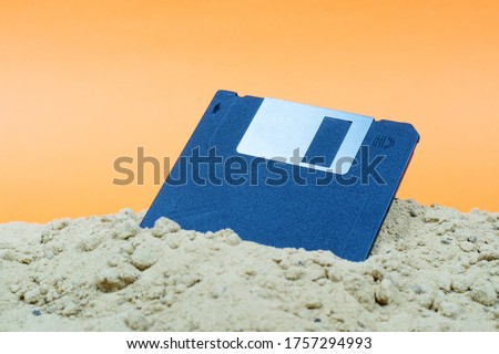 Image, Stock Photo A discarded floppy disk looks wistfully at the USB stick, which the mouse pointer prefers