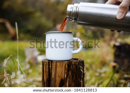 Similar – Image, Stock Photo Crop person pouring tea into bowl with herbs