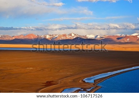 Taken in the lake Namtso. The lake Namtso is one of the highest lake in the world, lake Surface Altitude is 4718m. The Mountain of picture is Nyainqentanglha Range.