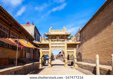 Chinese ancient stone decorated archway. Taken in the Chang\'s Manor Park of Yuci, Shanxi, China. In the park, there are a lot of Chinese ancient buildings that was Built in the Qing Dynasty.