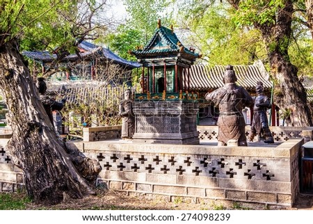 The iron statues terrace-Jinrentai. The three were casted in the Northern Song Dynasty(A.D. 960-1127) and one was casted in 1913. Jinci is a famous old garden of China. It lies in the Taiyuan,Shanxi.