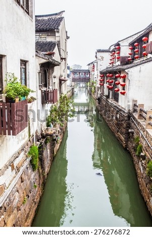 SUZHON, JIANGSU/CHINA-APR 14: Suzhou old town canals and folk houses on Apr 14,2015 in Suzhou, Jiangsu, China. Suzhou is one of the old watertowns in China. It is a famous tourist destination.