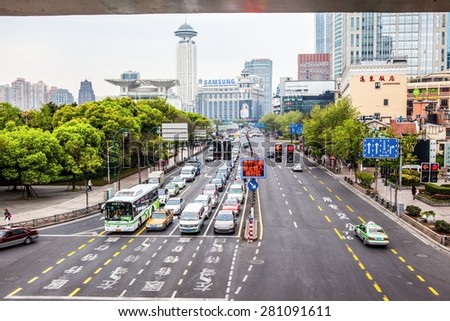 SHANGHAI/CHINA-APR16: Shanghai Streets scene on Apr 16,2015 in Shanghai, China. Taken on the Xizang Road.