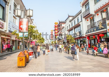 SUZHON, JIANGSU/CHINA-APR14: Most bustling commercial street-Guanqian street on Apr 14,2015 in Suzhou, Jiangsu, China. It is one of landmark in Suzhou old town. Suzhou is a famous tourist destination.