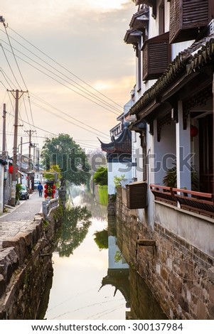 SUZHON, JIANGSU/CHINA-APR 12: Suzhou old town canals and folk houses on Apr 12,2015 in Suzhou, Jiangsu, China. Suzhou is one of the old watertowns in China. It is a famous tourist destination.