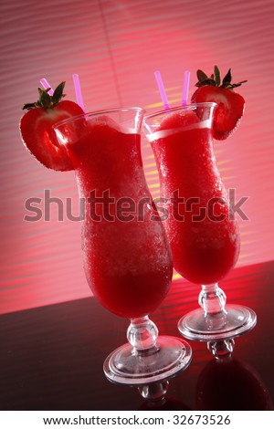 Strawberry daiquiri cocktail on wavy red may be an innocent smoothie if there\'s no alcohol in it