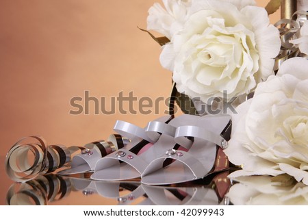 Wedding favors and white rose bouquet