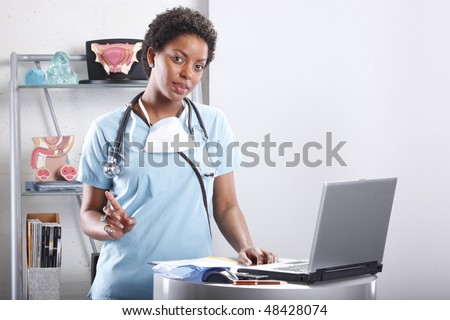 Cute afro-american doctor at her office