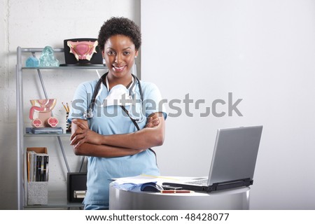 Cute afro-american doctor at her office