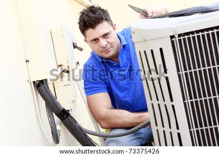 Technician inspects an AC unit Stock photo © 