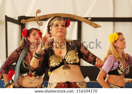 TULSA, OK - OCT 20: A member of Gypsy Fire Belly Dancers group performs a dance with a sword at Oktoberfest in TULSA, OK, on October 20, 2012 in TULSA, OK.