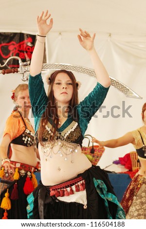 TULSA, OK - OCT 20: A member of Gypsy Fire Belly Dancers group performs a dance with a sword at Oktoberfest in TULSA, OK, on October 20, 2012 in TULSA, OK.