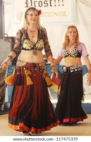 TULSA, OK - OCT 20: Members of Gypsy Fire Belly Dancers group perform at Oktoberfest in TULSA, OK, on October 20, 2012 in TULSA, OK.