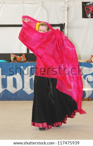 TULSA, OK - OCT 20: Gypsy Fire Belly Dancers group perform at Oktoberfest in TULSA, OK, on October 20, 2012 in TULSA, OK. Tulsa is the original place of Chicken Dance performed at Oktoberfest.