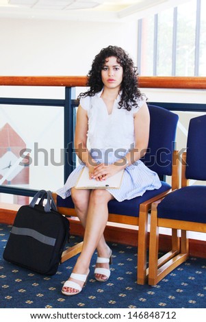 Young woman waits for business interview