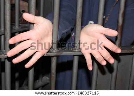 Man behind jail bars