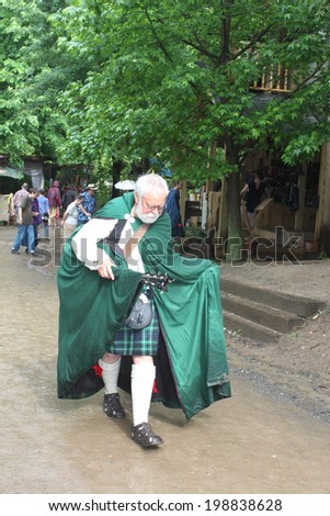 MUSKOGEE, OK - MAY 24: Older actors dressed in historical clothing perform during the Oklahoma 19th annual Renaissance Festival on May 24, 2014 at the Castle of Muskogee in Muskogee, OK.