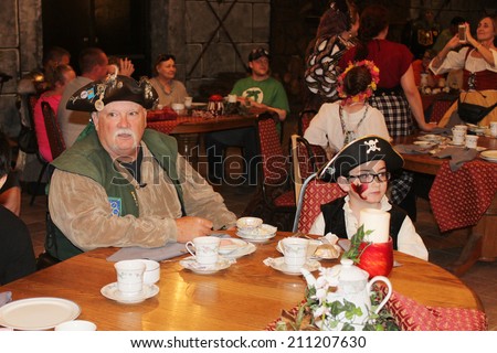 MUSKOGEE, OK - MAY 24: Royal ladies enjoy queen\'s tea at the Oklahoma 19th annual Renaissance Festival on May 24, 2014 at the Castle of Muskogee in Muskogee, OK