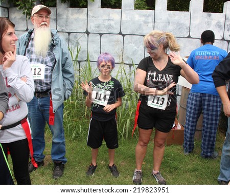 MUSKOGEE, OK - Sept. 13: Runners wait for the start of second annual Castle Zombie Run at the Castle of Muskogee in Muskogee, OK on September 13, 2014.